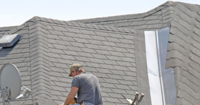 Roof Contractor in Grand Rapids Michigan Installing 3 Tab Shingles